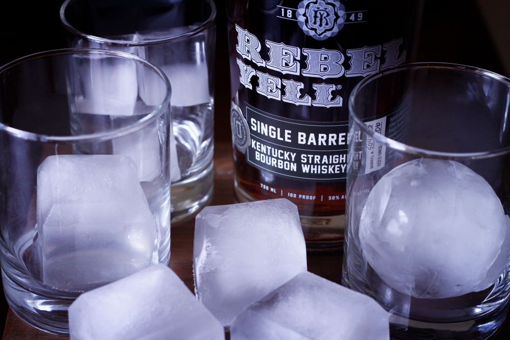 Bourbon with one big ice cube - only way to go.